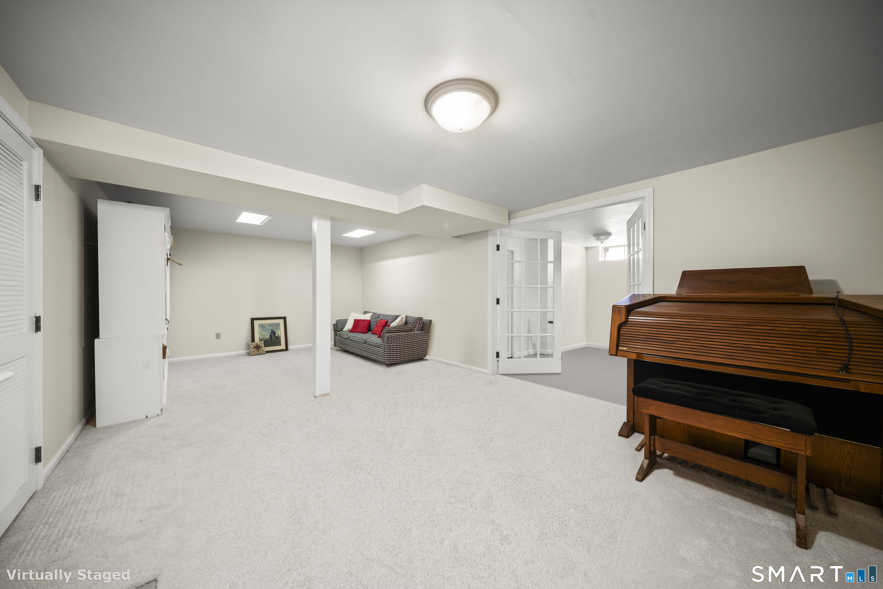 230 East Bass Lane, Unit 230 Suffield, CT 06078 - Photo 22 of 35 a view of a livingroom with furniture and a ceiling fan