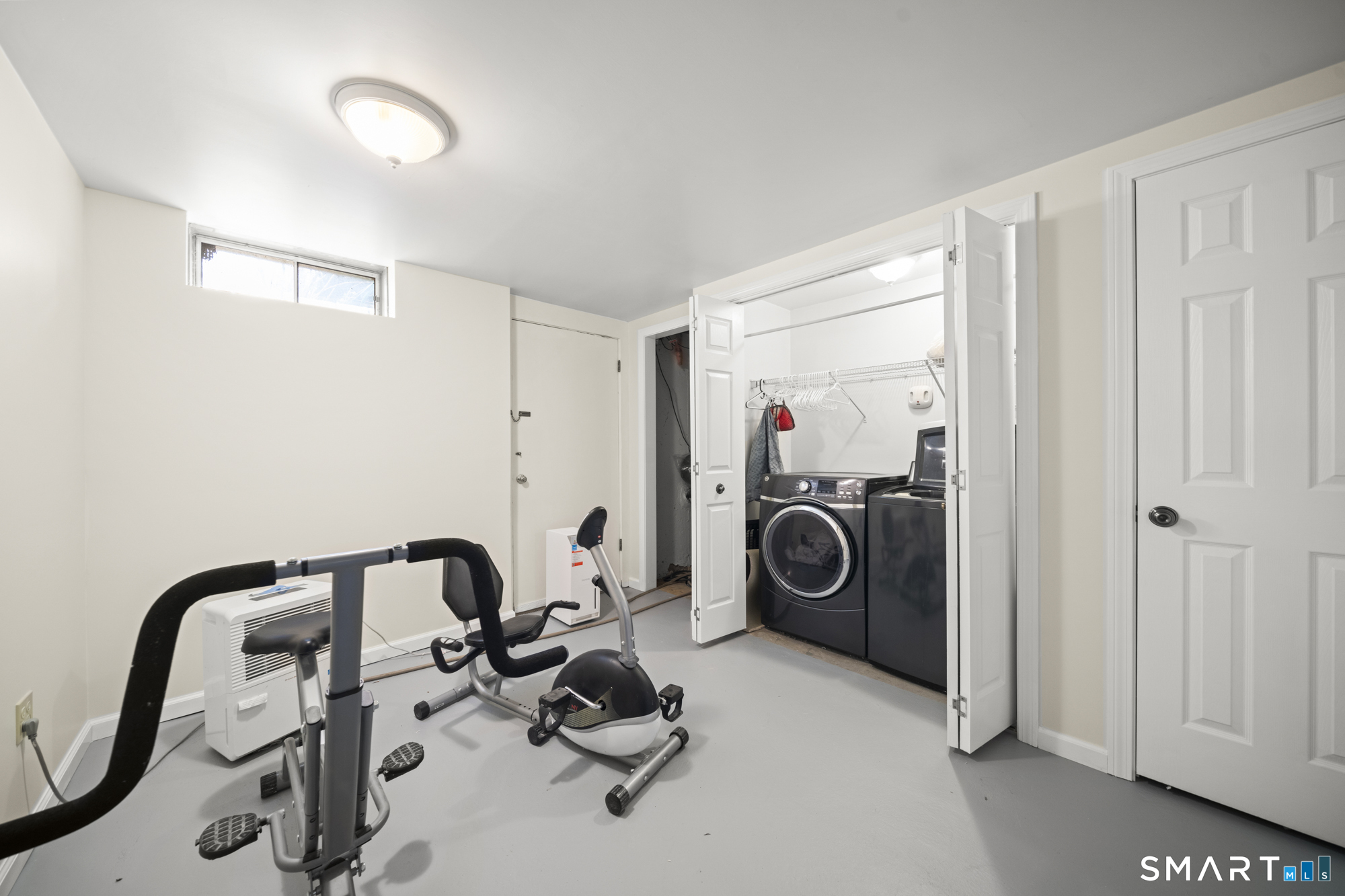 230 East Bass Lane, Unit 230 Suffield, CT 06078 - Photo 25 of 35 a view of a storage and utility room with washer and dryer