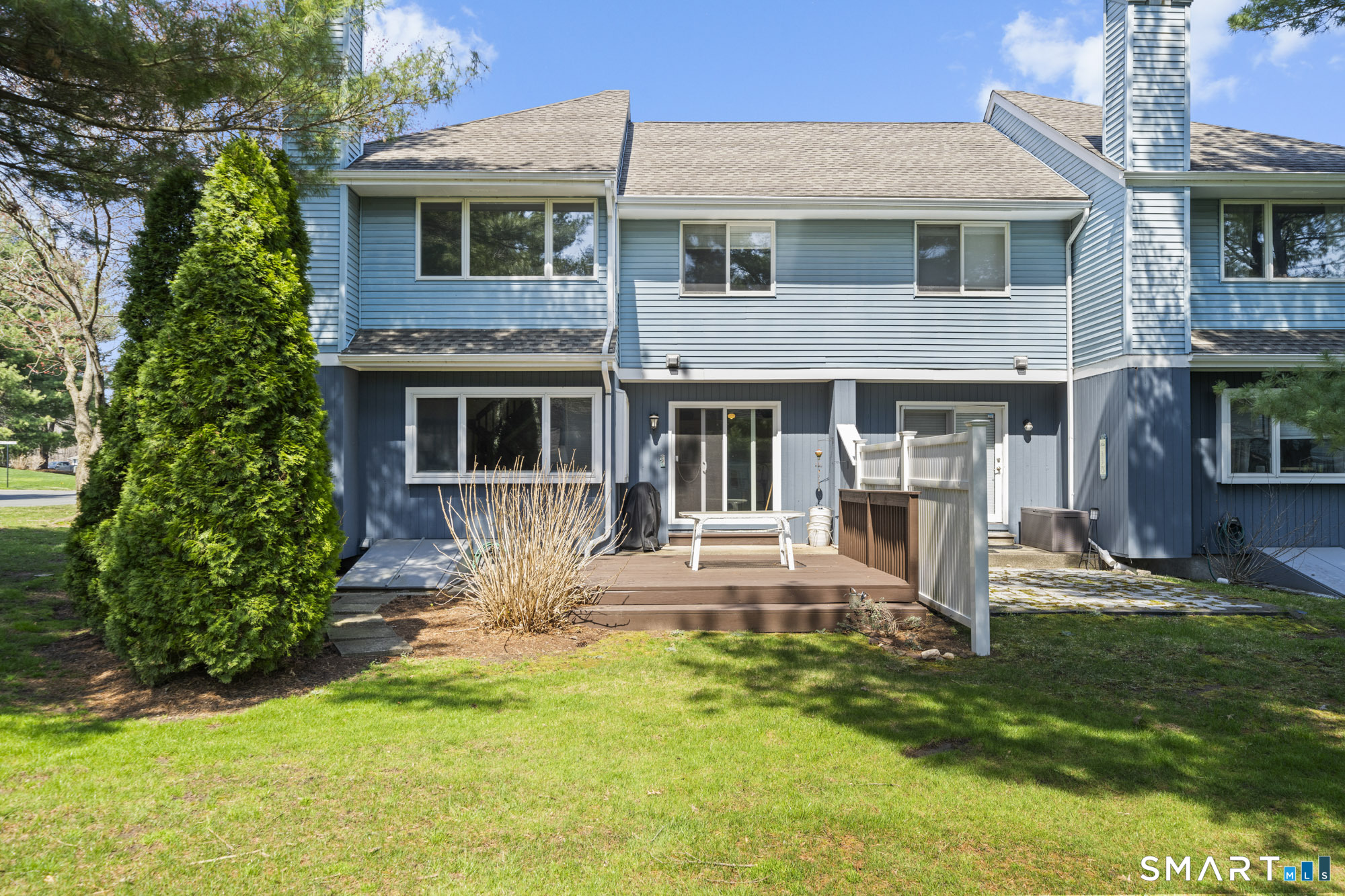 230 East Bass Lane, Unit 230 Suffield, CT 06078 - Photo 29 of 35 a front view of a house with a yard