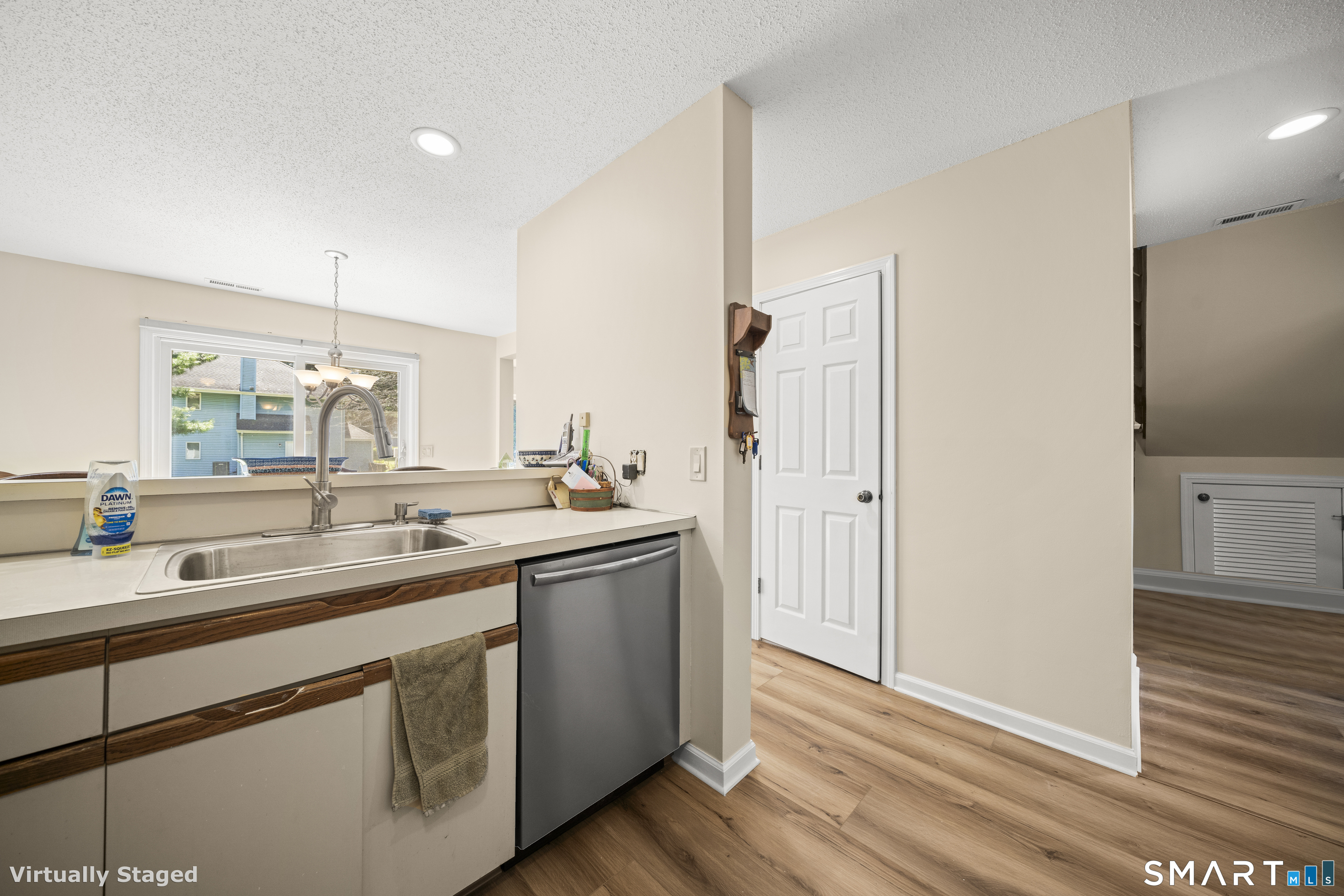 230 East Bass Lane, Unit 230 Suffield, CT 06078 - Photo 7 of 35 a kitchen with a sink and a refrigerator