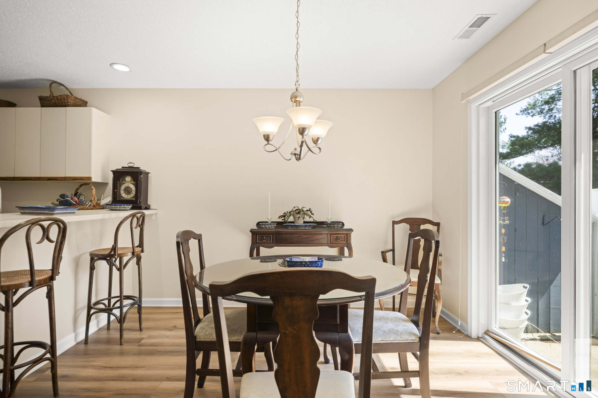 230 East Bass Lane, Unit 230 Suffield, CT 06078 - Photo 10 of 35 a view of a dining room with furniture window and outside view