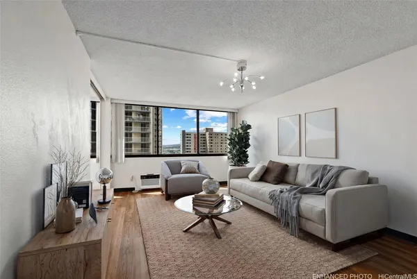 a living room with furniture and a large window