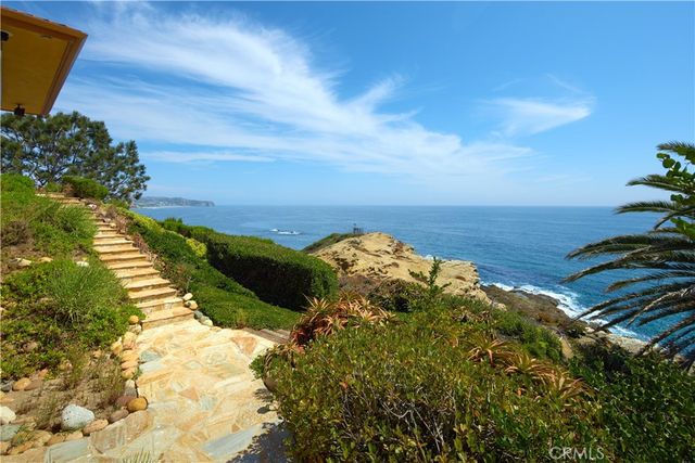 a balcony with furniture and a potted plant