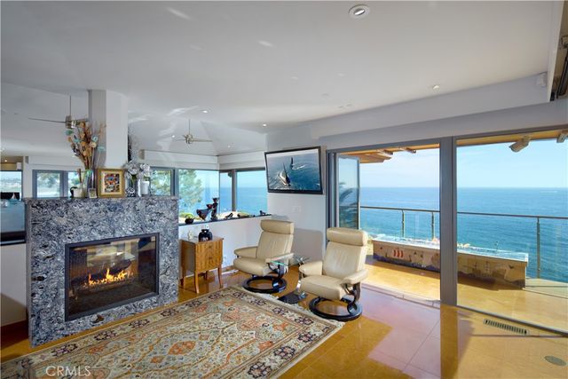 a view of swimming pool with outdoor seating