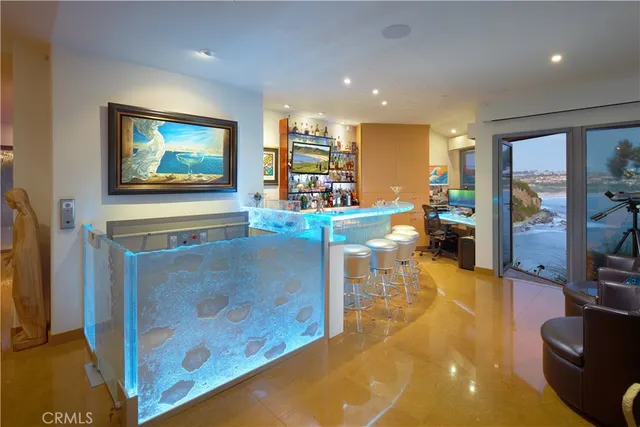 a bedroom with a bed a flat screen tv and a large window