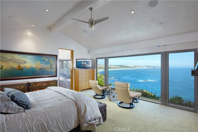 a bedroom with a bed and a desk