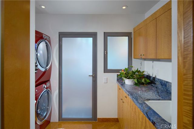 a view of a swimming pool with a patio and a garden