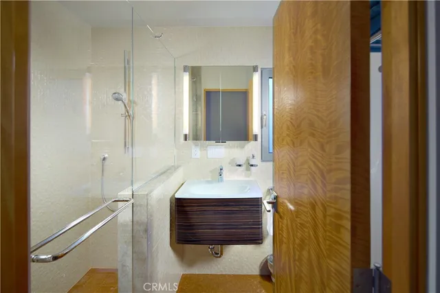 a view of a backyard with plants and a garage