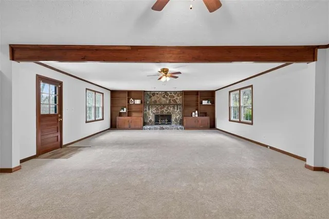 a view of a livingroom with furniture and chandelier