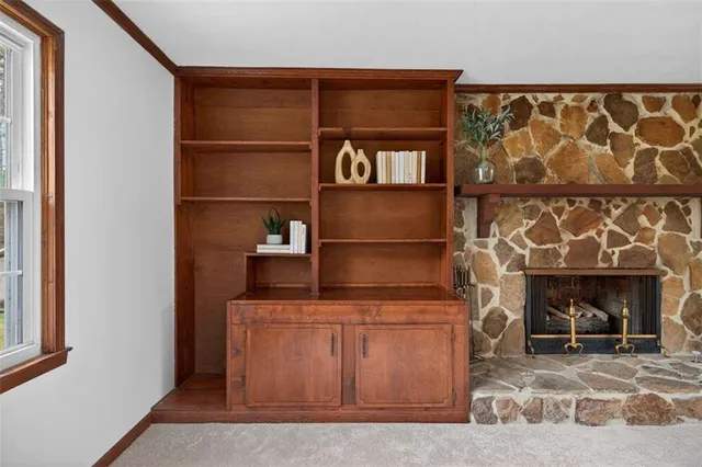 a living room with a fireplace