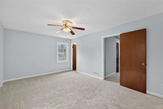 a view of a big room with carpet