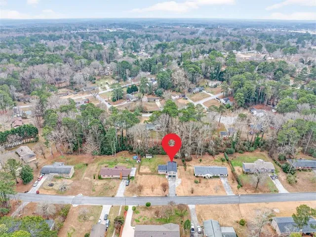 an aerial view of residential houses with outdoor space