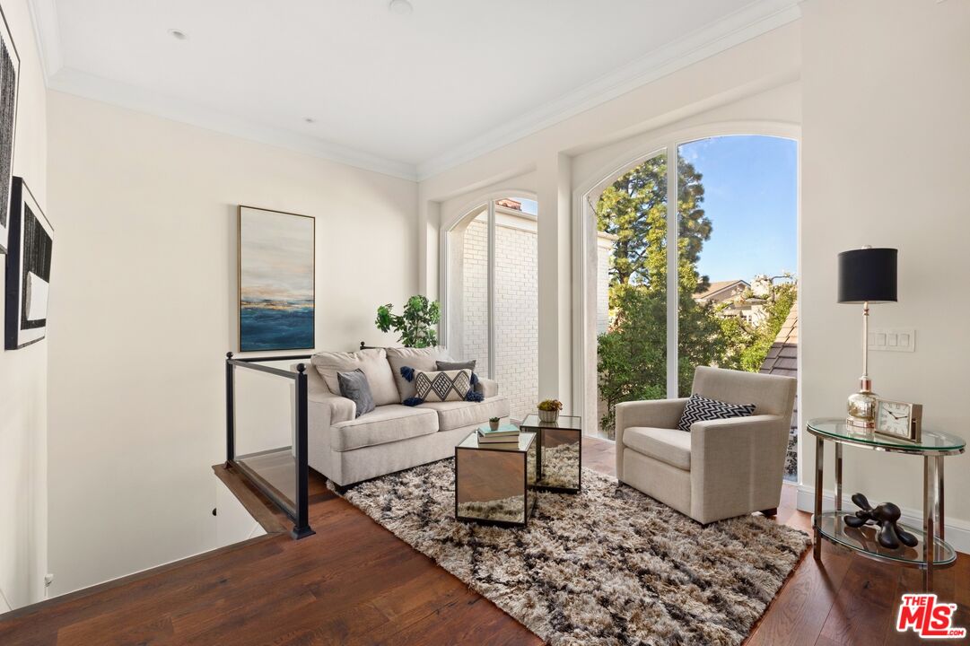 12320 Ridge Circle Los Angeles, CA 90049 - Photo 16 of 38 a living room with furniture and a window
