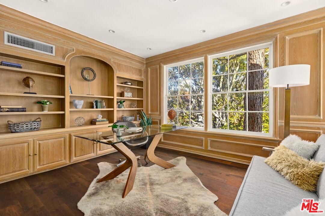 12320 Ridge Circle Los Angeles, CA 90049 - Photo 26 of 38 a view of a livingroom with workspace and a window