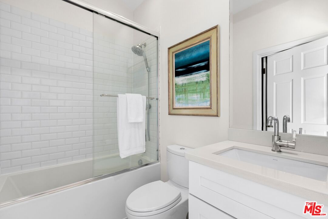 12320 Ridge Circle Los Angeles, CA 90049 - Photo 28 of 38 a bathroom with a sink toilet and shower