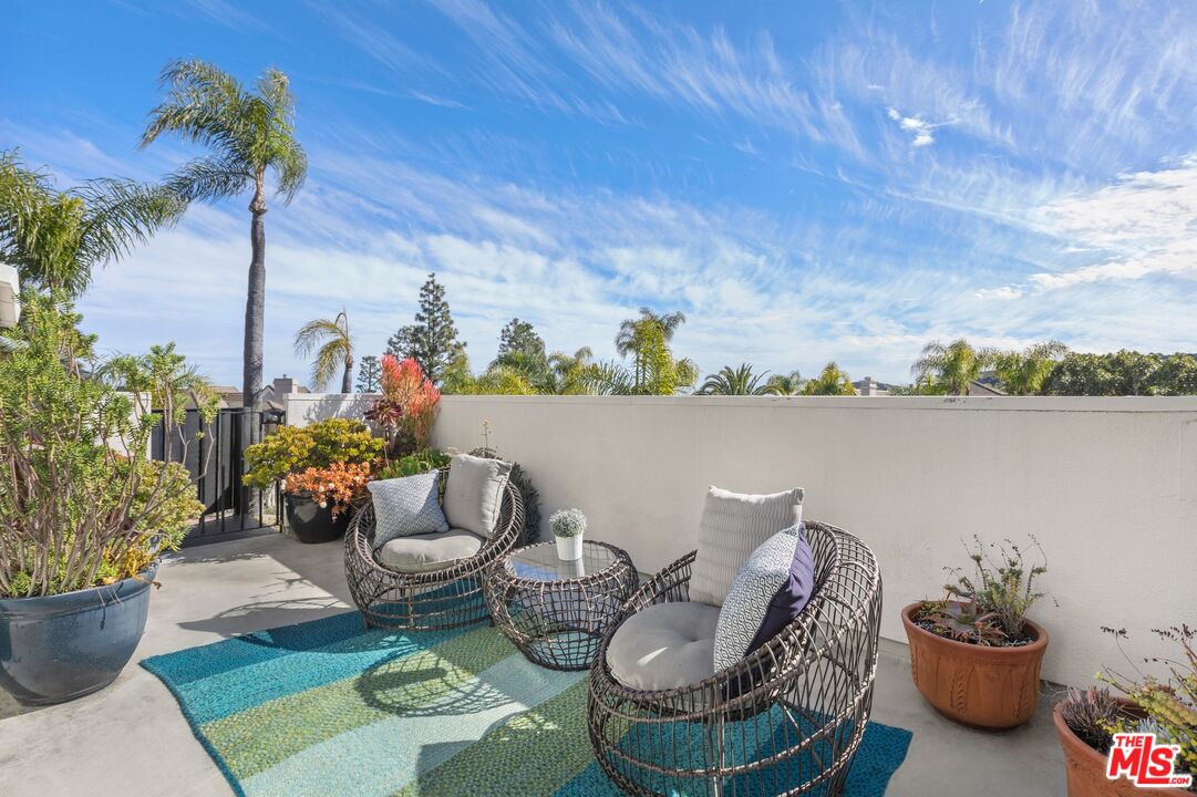 12320 Ridge Circle Los Angeles, CA 90049 - Photo 31 of 38 a view of a patio with furniture and potted plants