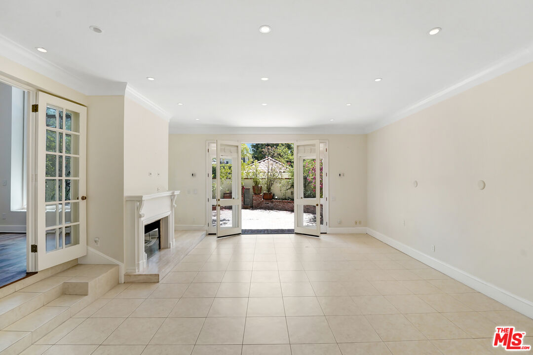 12320 Ridge Circle Los Angeles, CA 90049 - Photo 8 of 38 a view of an empty room with furniture and a window