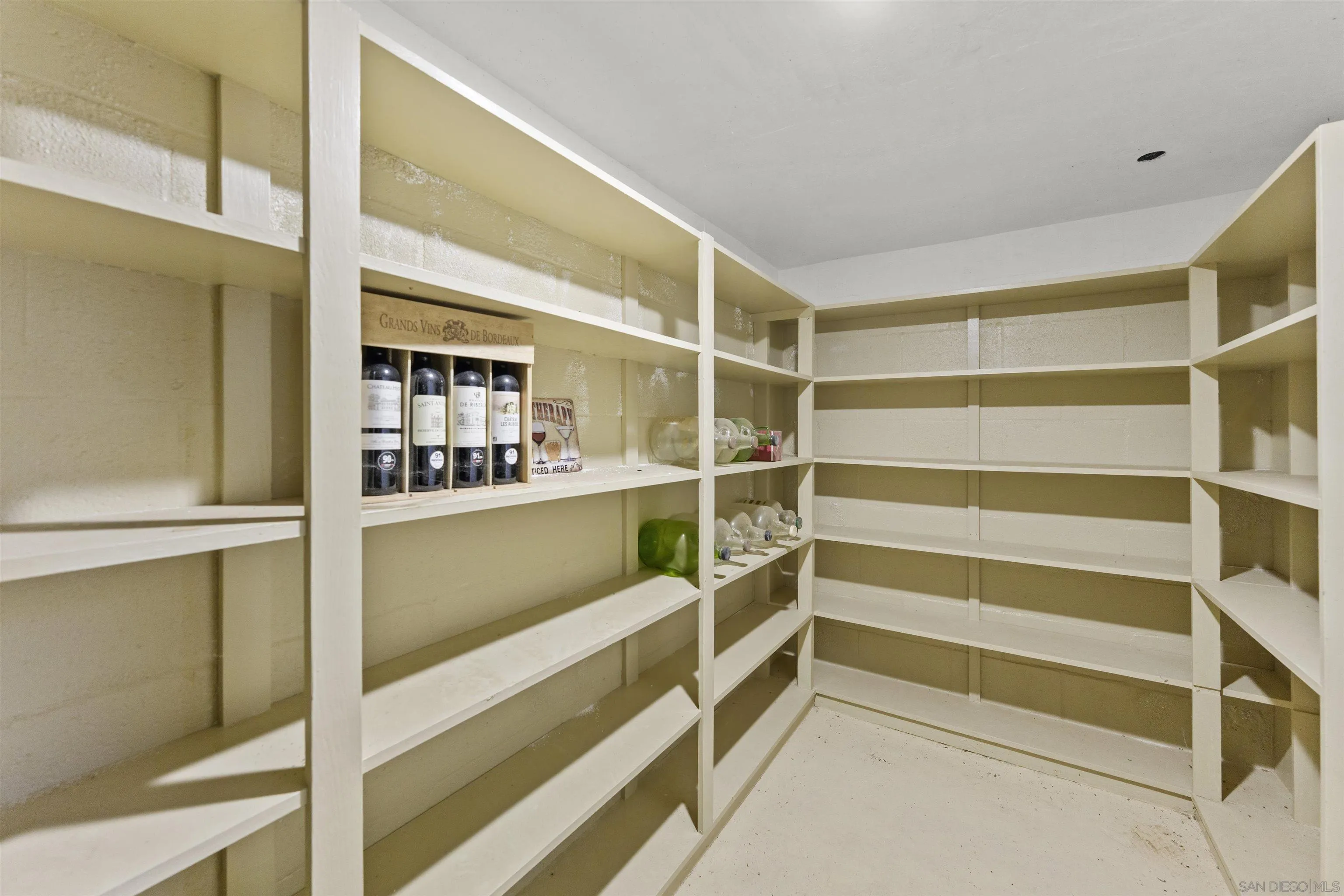 30659 Diaz Road Valley Center, CA 92082 - Photo 18 of 44 a view of walk in closet with empty racks