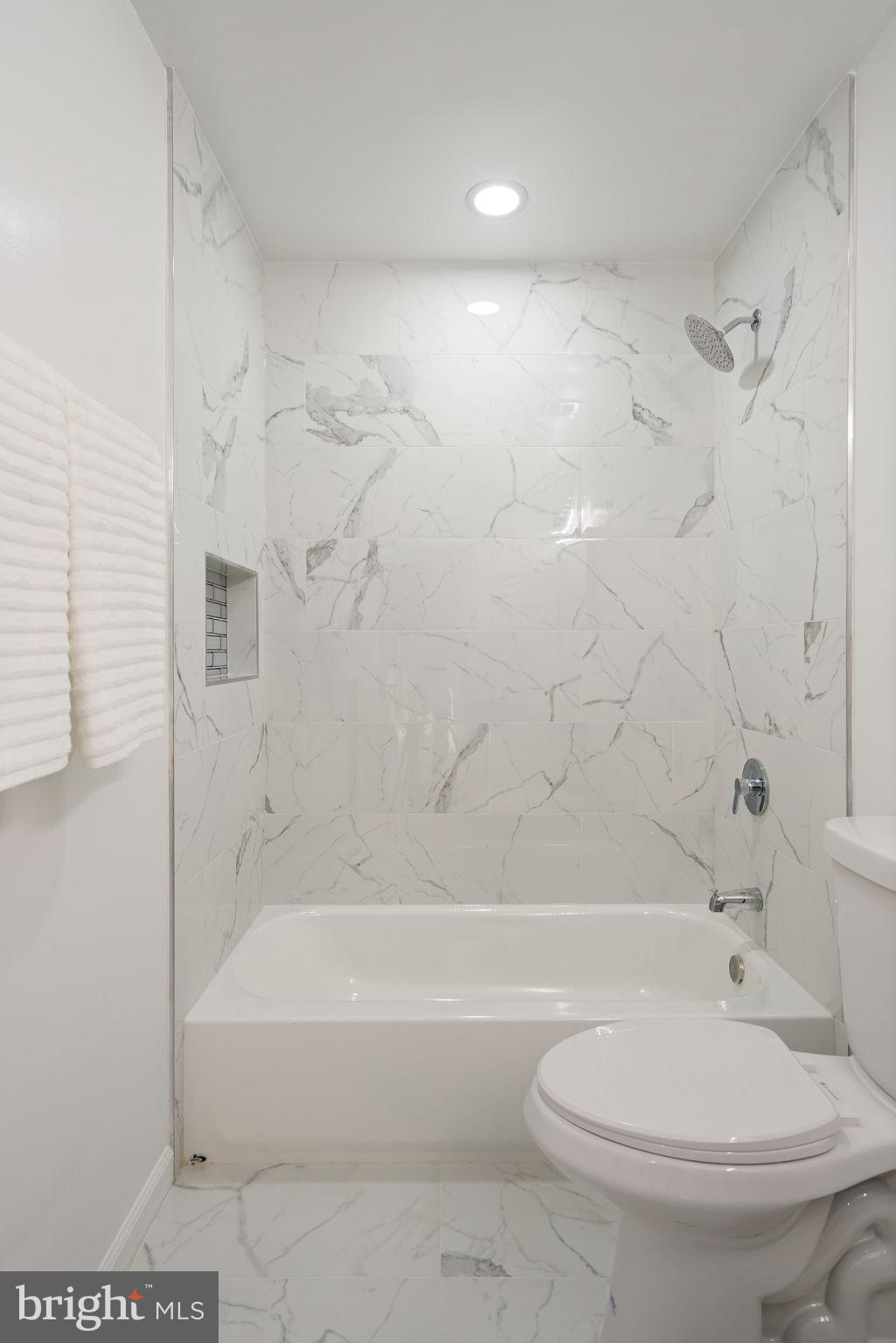 11446 Links Drive Reston, VA 20190 - Photo 41 of 87 Elegant Tile from Tub to Ceiling