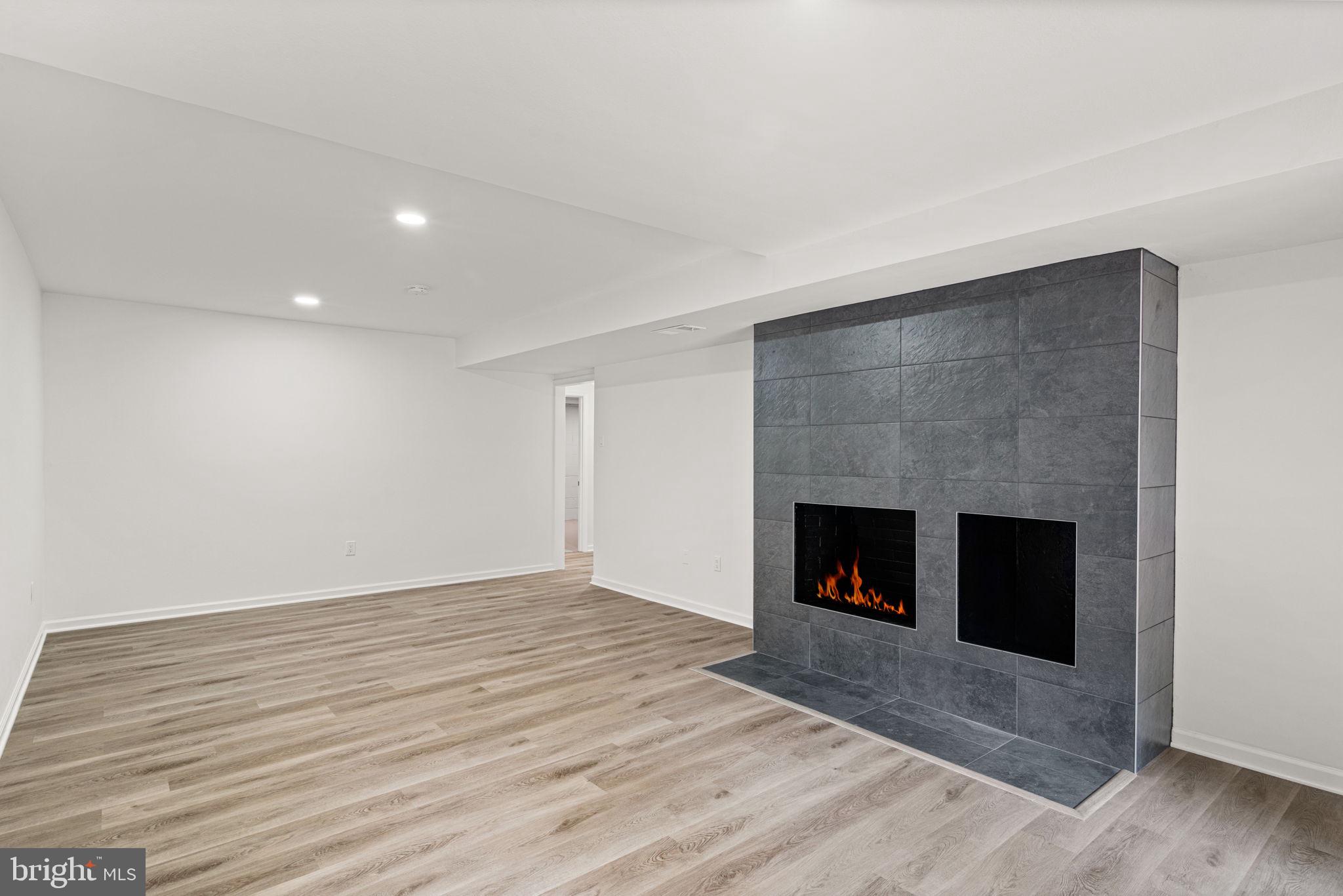11446 Links Drive Reston, VA 20190 - Photo 54 of 87 Woodburning Fireplace and New Luxury Vinyl Plank