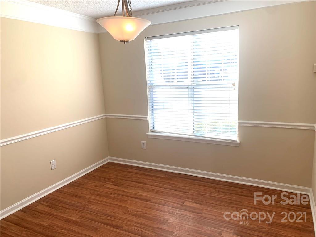 210 Forest Pond Road Kannapolis, NC 28083 - Photo 4 of 10 a view of a room with wooden floor and windows