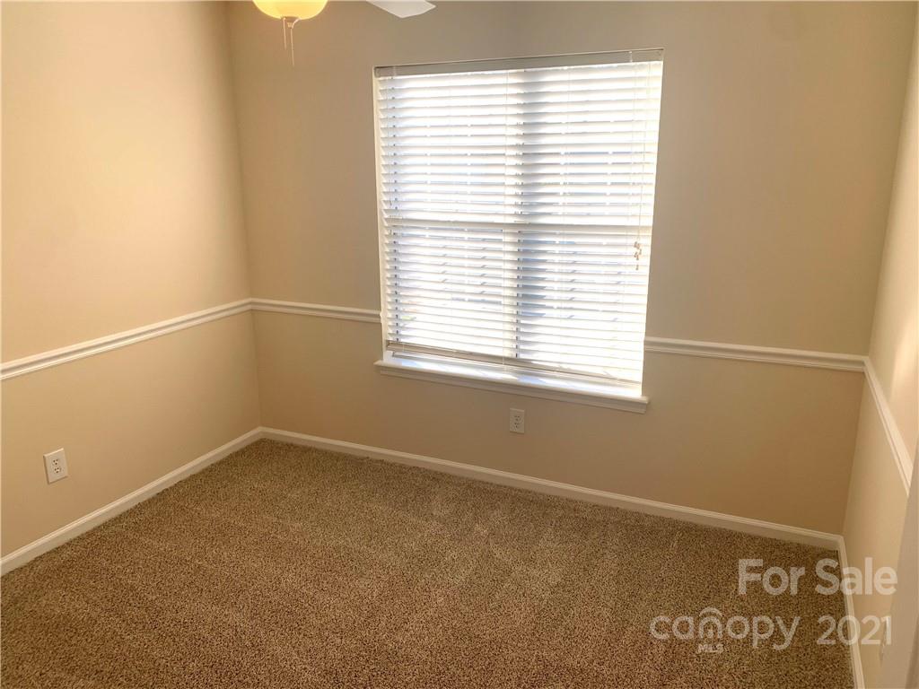 210 Forest Pond Road Kannapolis, NC 28083 - Photo 5 of 10 an empty room with a window