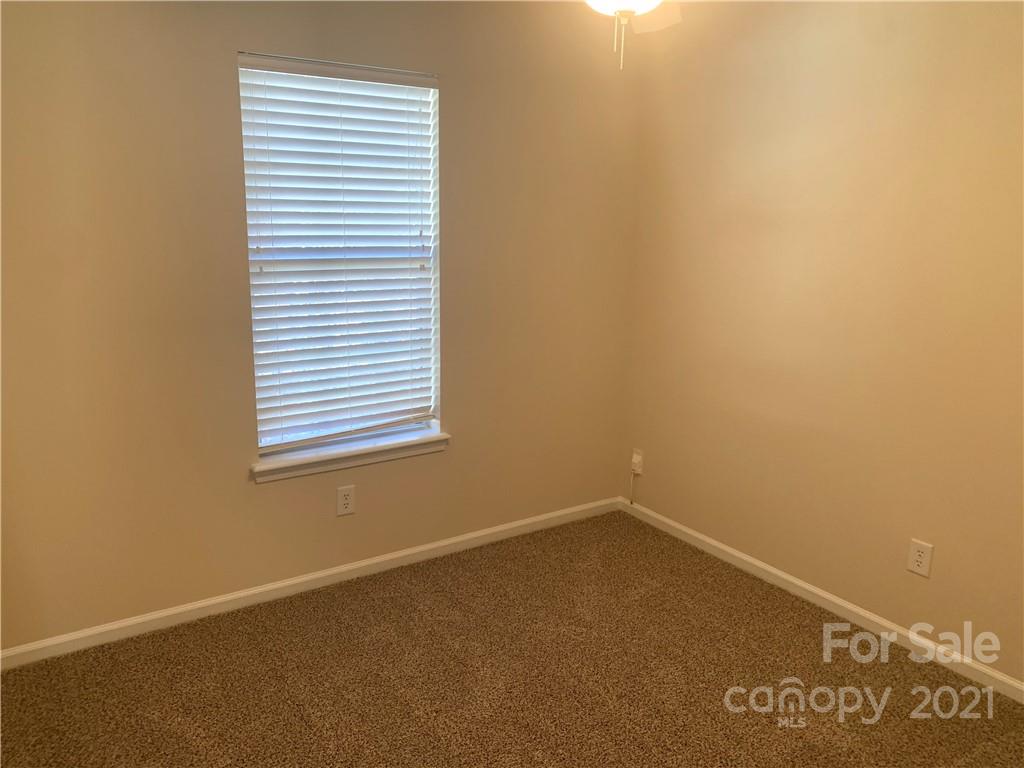 210 Forest Pond Road Kannapolis, NC 28083 - Photo 6 of 10 an empty room with a window