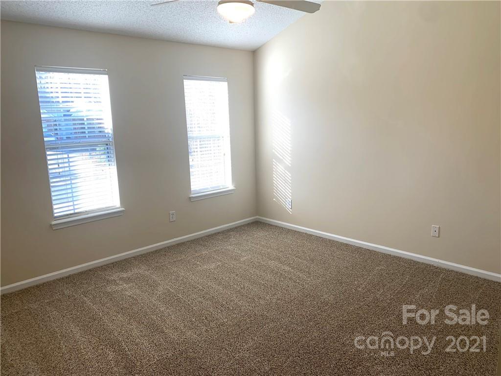 210 Forest Pond Road Kannapolis, NC 28083 - Photo 7 of 10 an empty room with windows