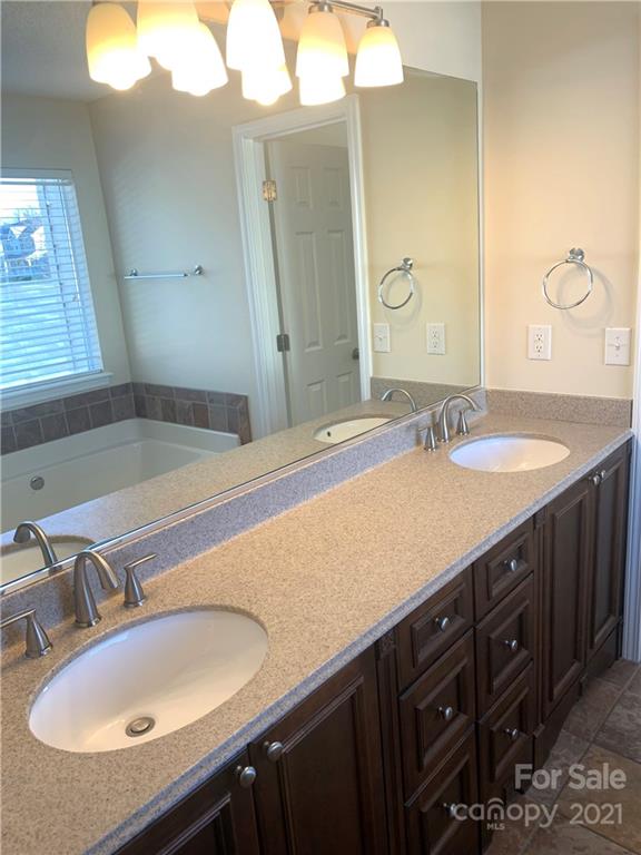 210 Forest Pond Road Kannapolis, NC 28083 - Photo 8 of 10 a bathroom with a sink and a mirror