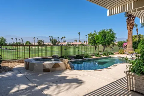 a view of a backyard with sitting area