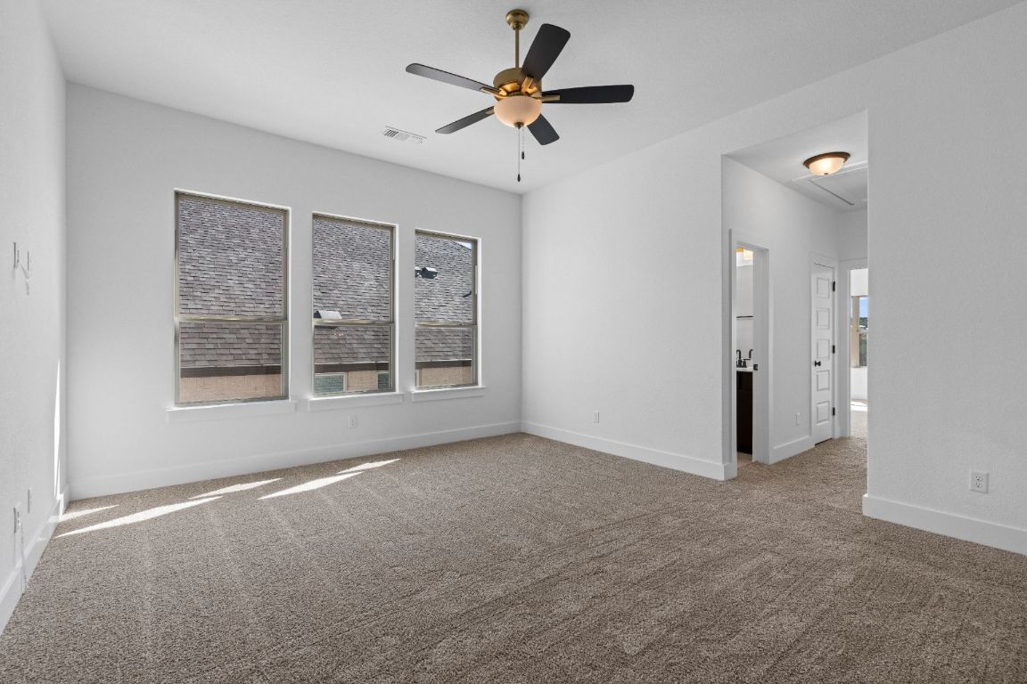1620 Lilly Grace Bend Leander, TX 78641 - Photo 21 of 40 a view of an empty room with a window