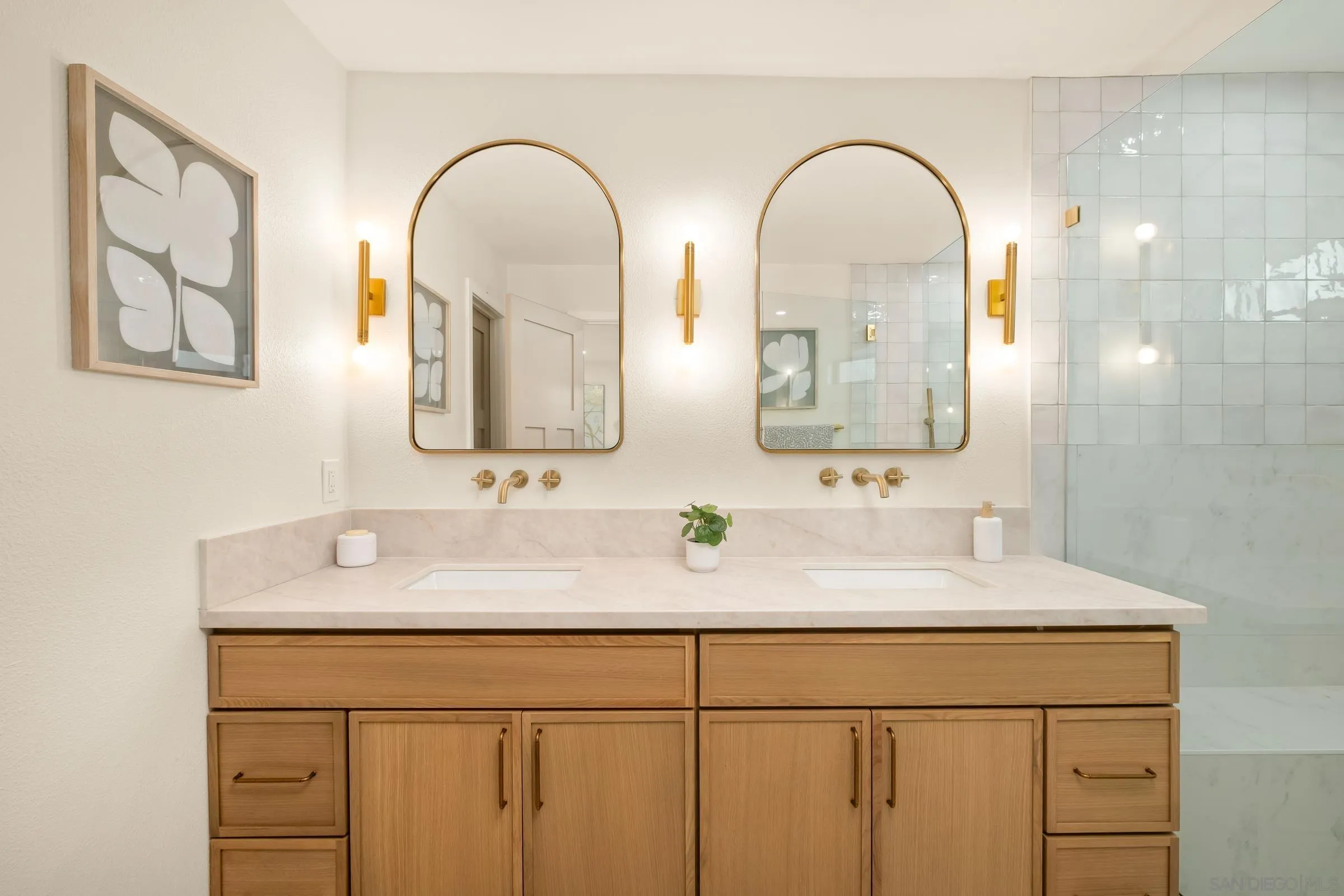 3985 Syme Drive Carlsbad, CA 92008 - Photo 20 of 29 a bathroom with a double vanity sink and a mirror