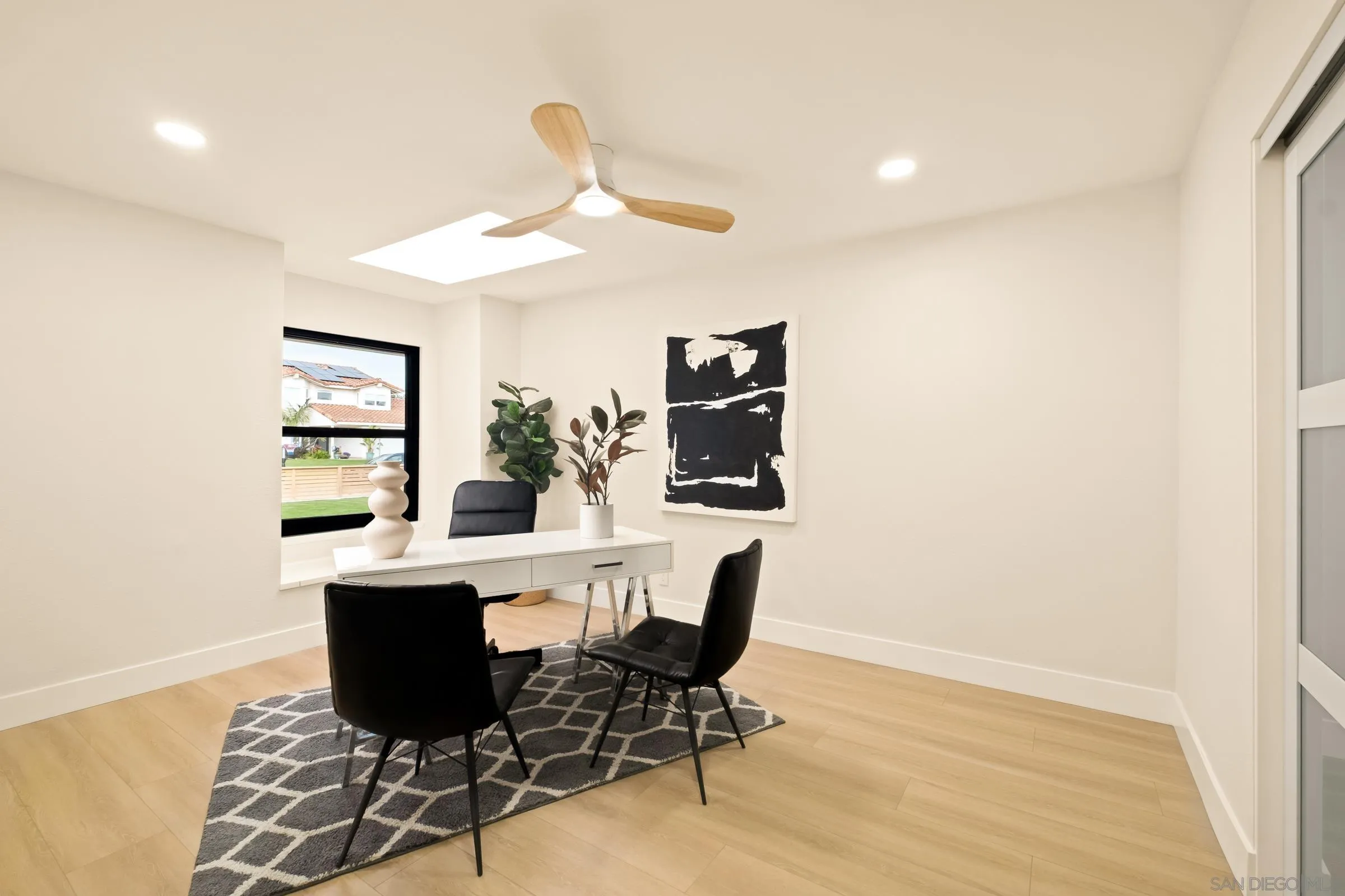 3985 Syme Drive Carlsbad, CA 92008 - Photo 22 of 29 a view of a dining room with furniture and wooden floor