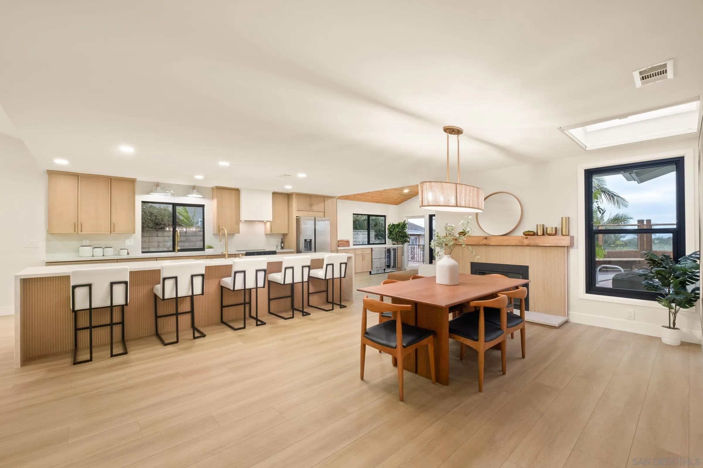 3985 Syme Drive Carlsbad, CA 92008 - Photo 8 of 29 a view of a dining room with furniture window and wooden floor