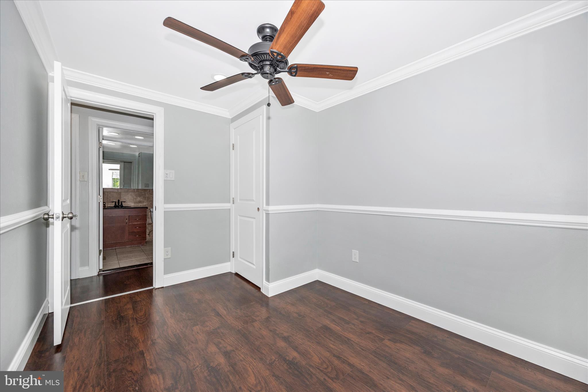 101 Andover Court Frederick, MD 21702 - Photo 12 of 29 an empty room with wooden floor fan and windows