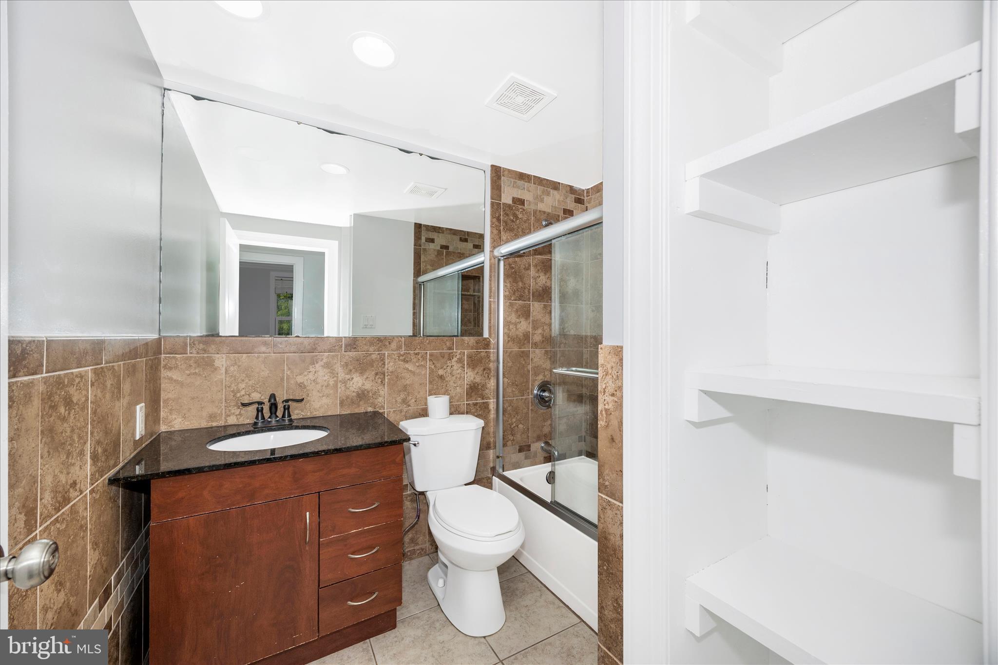 101 Andover Court Frederick, MD 21702 - Photo 13 of 29 a bathroom with a sink a toilet and shower