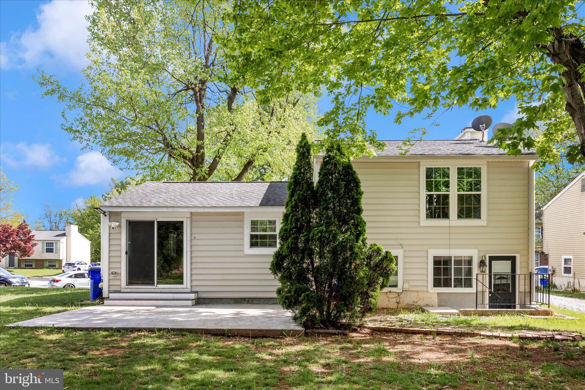 101 Andover Court Frederick, MD 21702 - Photo 19 of 29 a front view of a house with a yard garage and outdoor seating