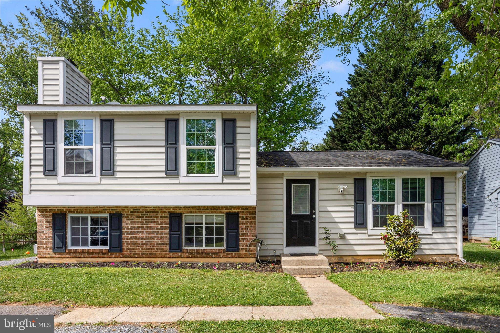 101 Andover Court Frederick, MD 21702 - Photo 27 of 29 a front view of a house with a yard and porch