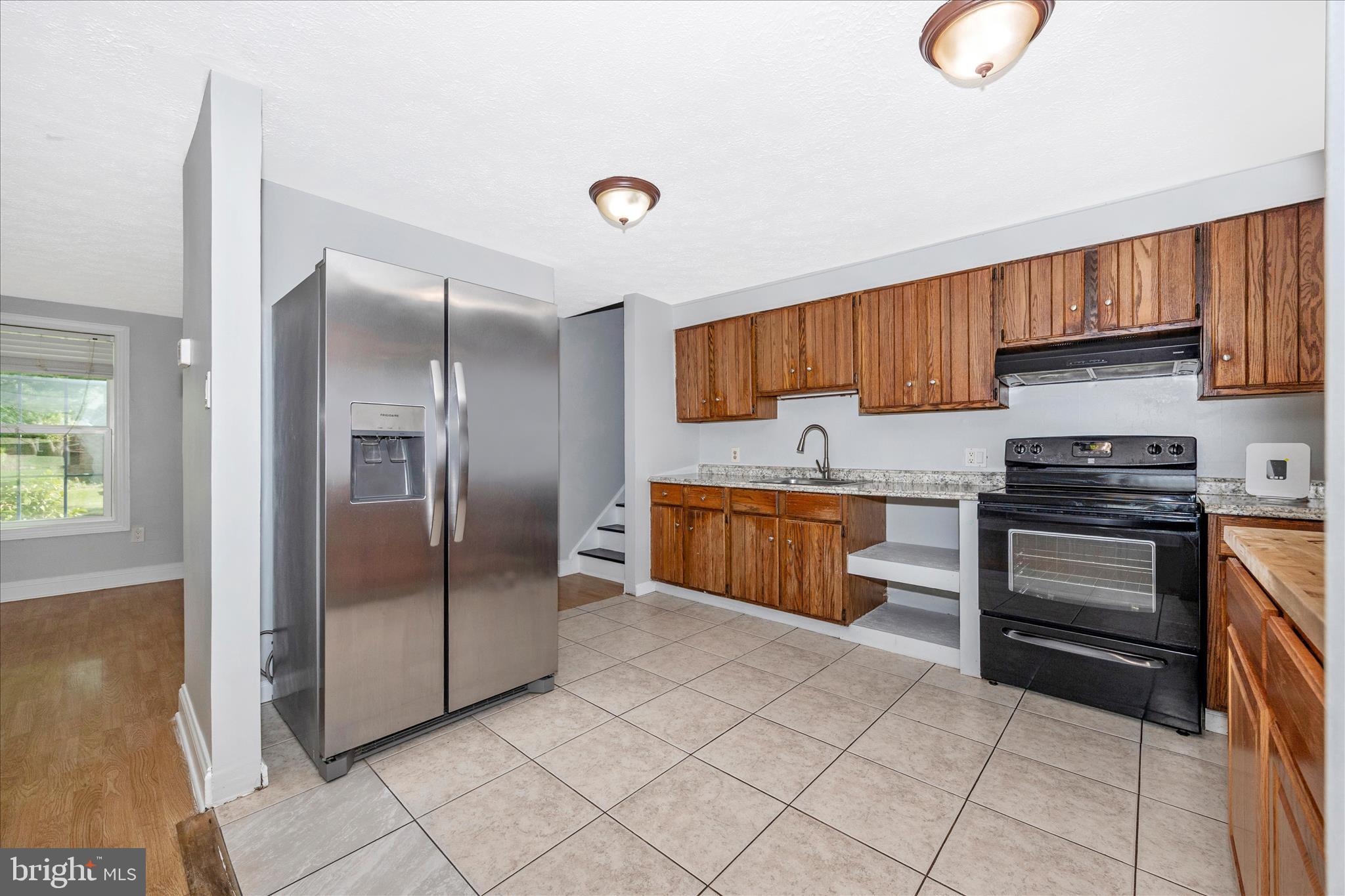101 Andover Court Frederick, MD 21702 - Photo 7 of 29 a kitchen with stainless steel appliances a stove a sink and a refrigerator