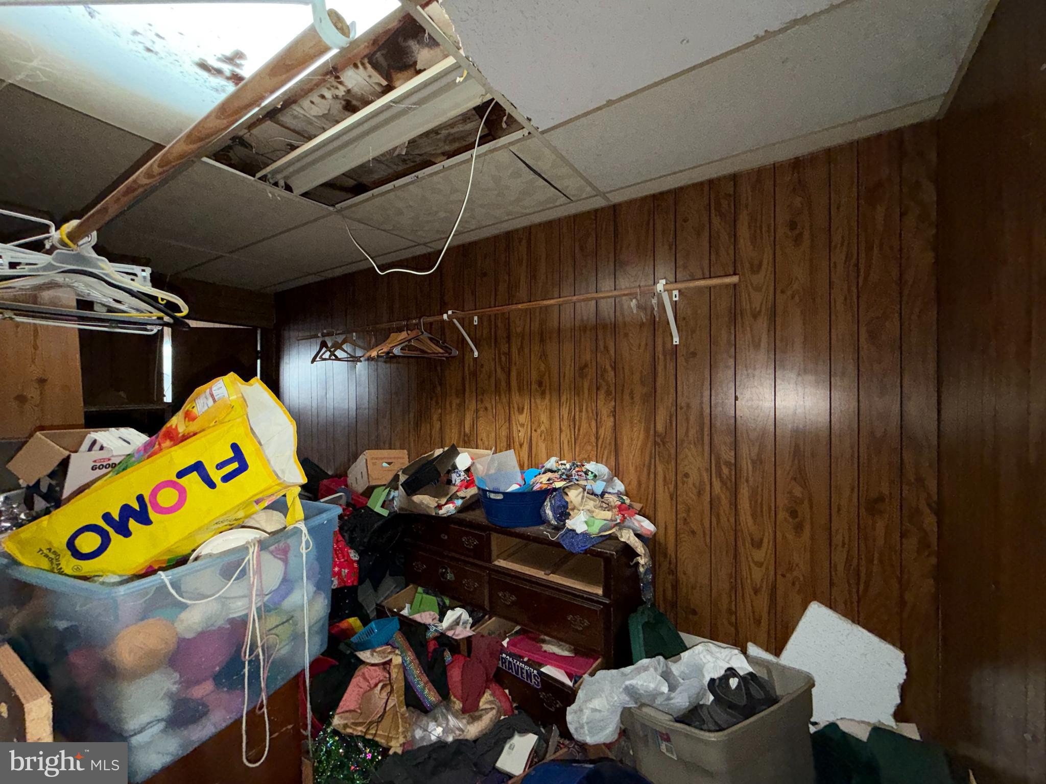 2667 St Benedict Street Baltimore, MD 21223 - Photo 14 of 14 a store room with lots of different colored cloths