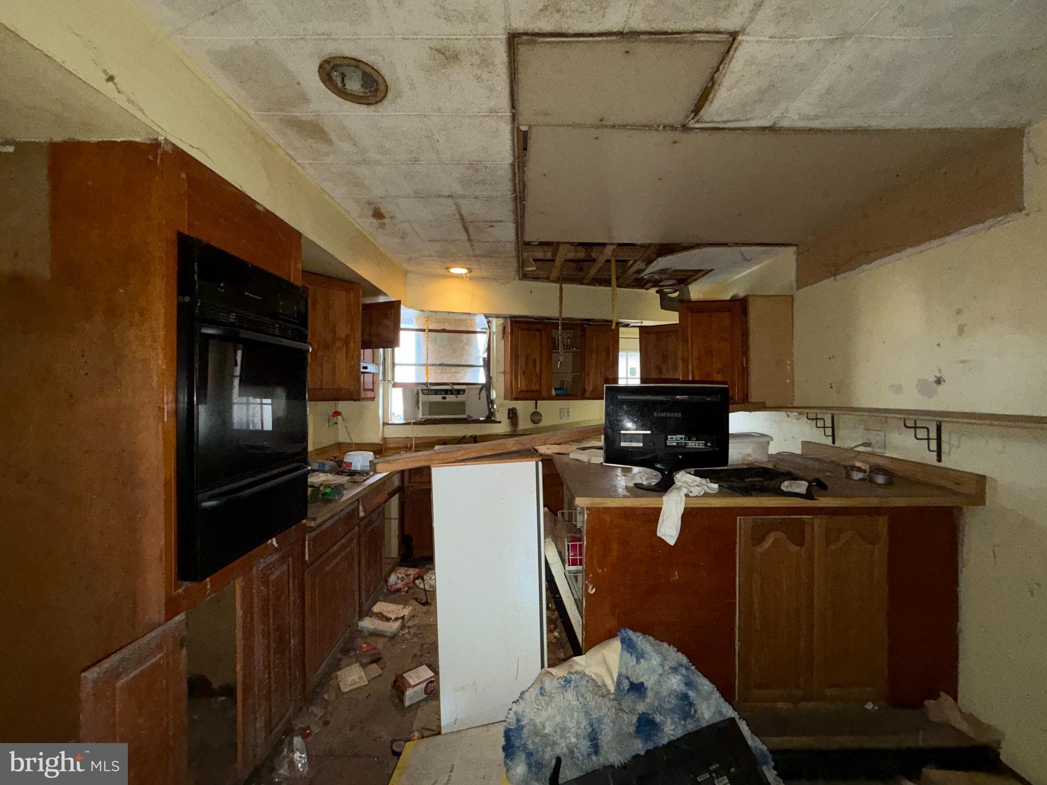 2667 St Benedict Street Baltimore, MD 21223 - Photo 7 of 14 a kitchen with a sink appliances and cabinets