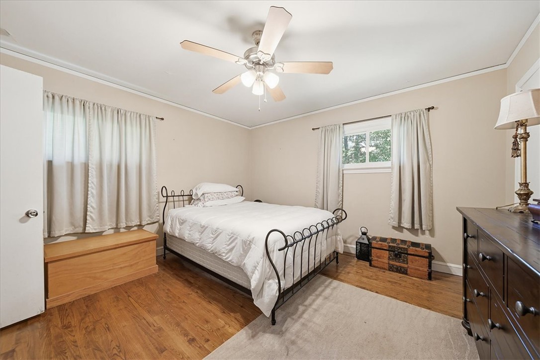 504 Jeb Stuart Avenue Anderson, SC 29621 - Photo 28 of 47 This cozy bedroom features hardwood floors and ample natural light, creating a serene personal retreat.