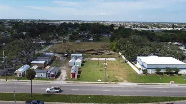 an aerial view of houses with yard