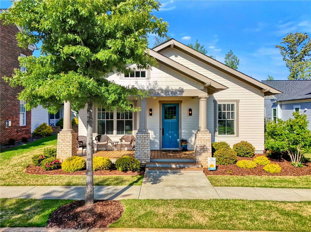 This charming home offers an inviting porch perfect for outdoor relaxation.