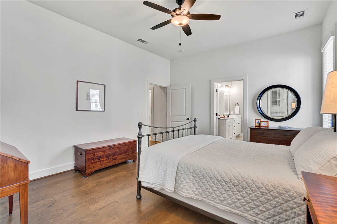 308 Pershing Avenue Clemson, SC 29631 - Photo 13 of 31 This inviting bedroom features rich hardwood flooring and a ceiling fan, offering a comfortable retreat.