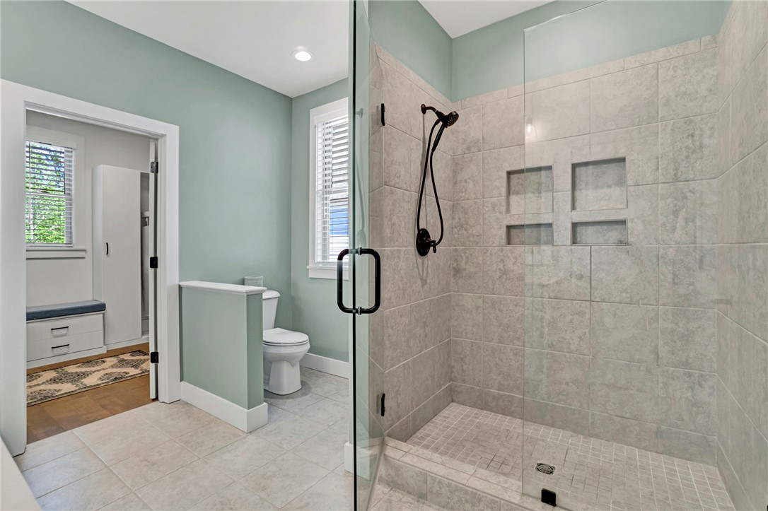 308 Pershing Avenue Clemson, SC 29631 - Photo 15 of 31 This modern bathroom features a sleek, tiled shower and thoughtful design for comfortable daily routines.