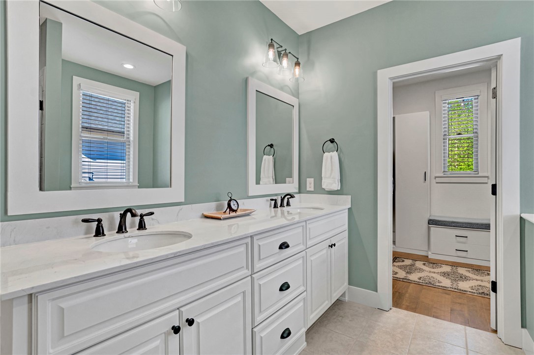 308 Pershing Avenue Clemson, SC 29631 - Photo 16 of 31 This spacious bathroom offers dual vanities with ample storage and elegant fixtures.