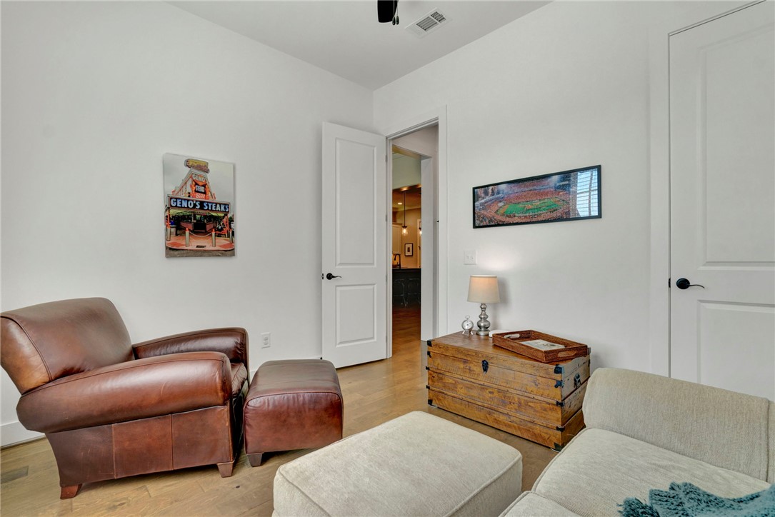 308 Pershing Avenue Clemson, SC 29631 - Photo 19 of 31 This cozy space features pristine white walls and elegant hardwood flooring, ideal for relaxation or a quiet retreat.