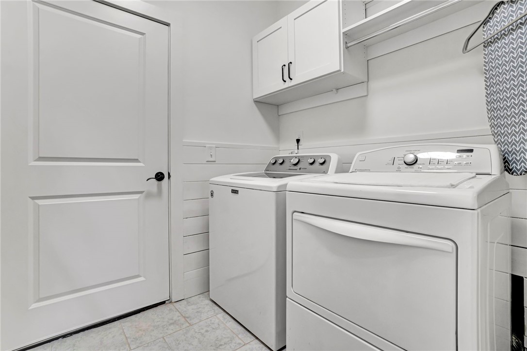 308 Pershing Avenue Clemson, SC 29631 - Photo 25 of 31 This dedicated laundry area offers practical convenience with essential appliances and storage.