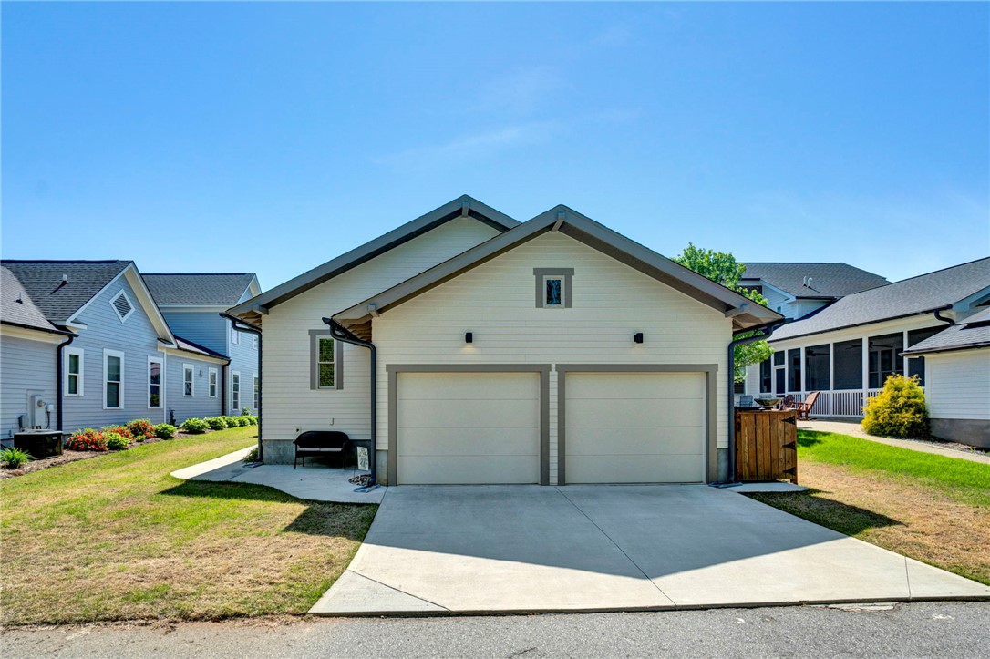 308 Pershing Avenue Clemson, SC 29631 - Photo 27 of 31 This home features a convenient attached garage with a paved driveway.